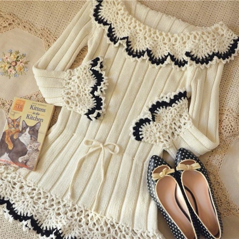 cream sweater dress with black details